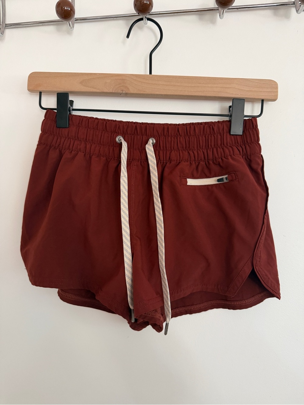 Vuori Women's Athletic Shorts in Deep Brick